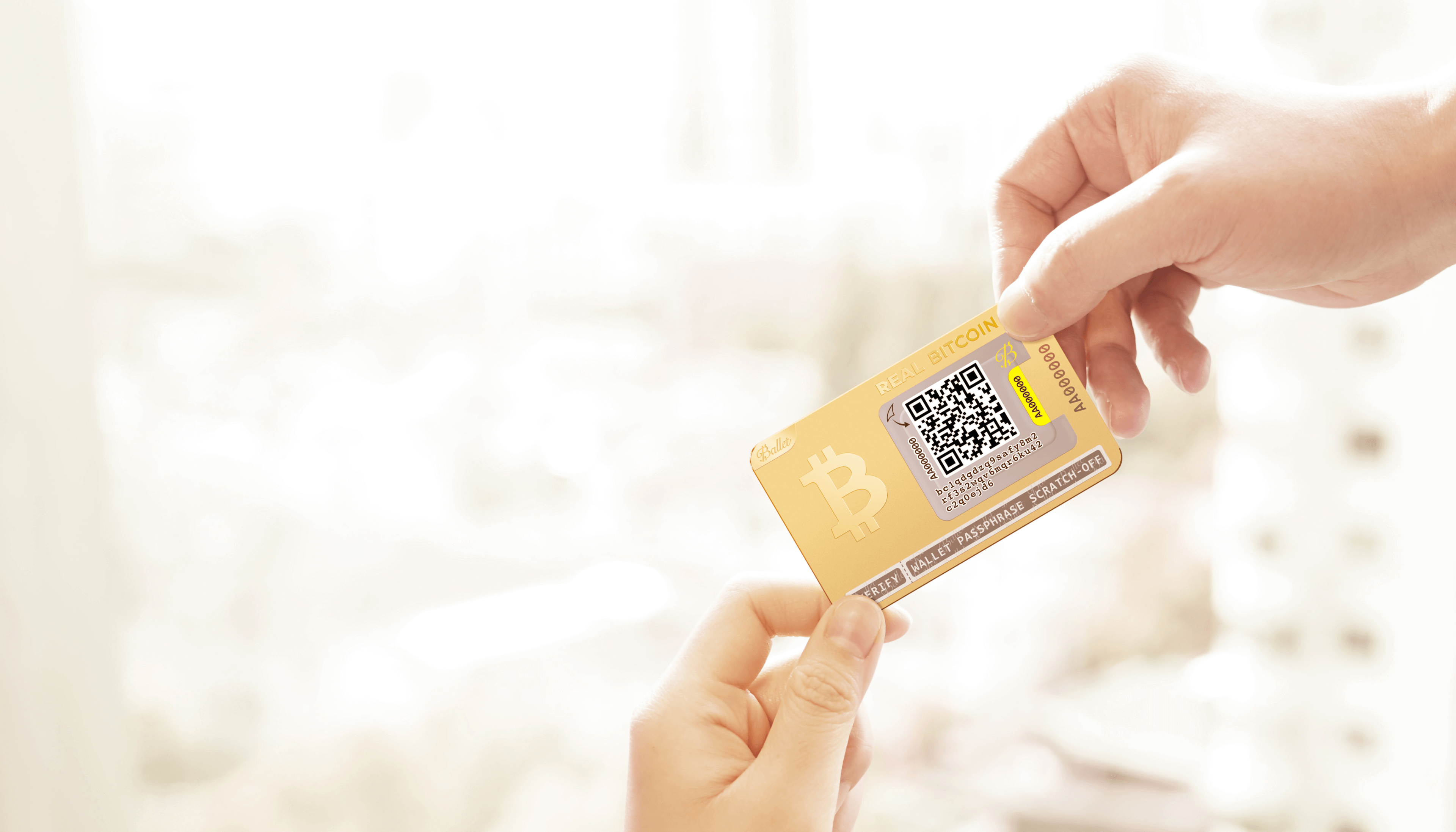 Hands holding a Ballet REAL Bitcoin cold storage card